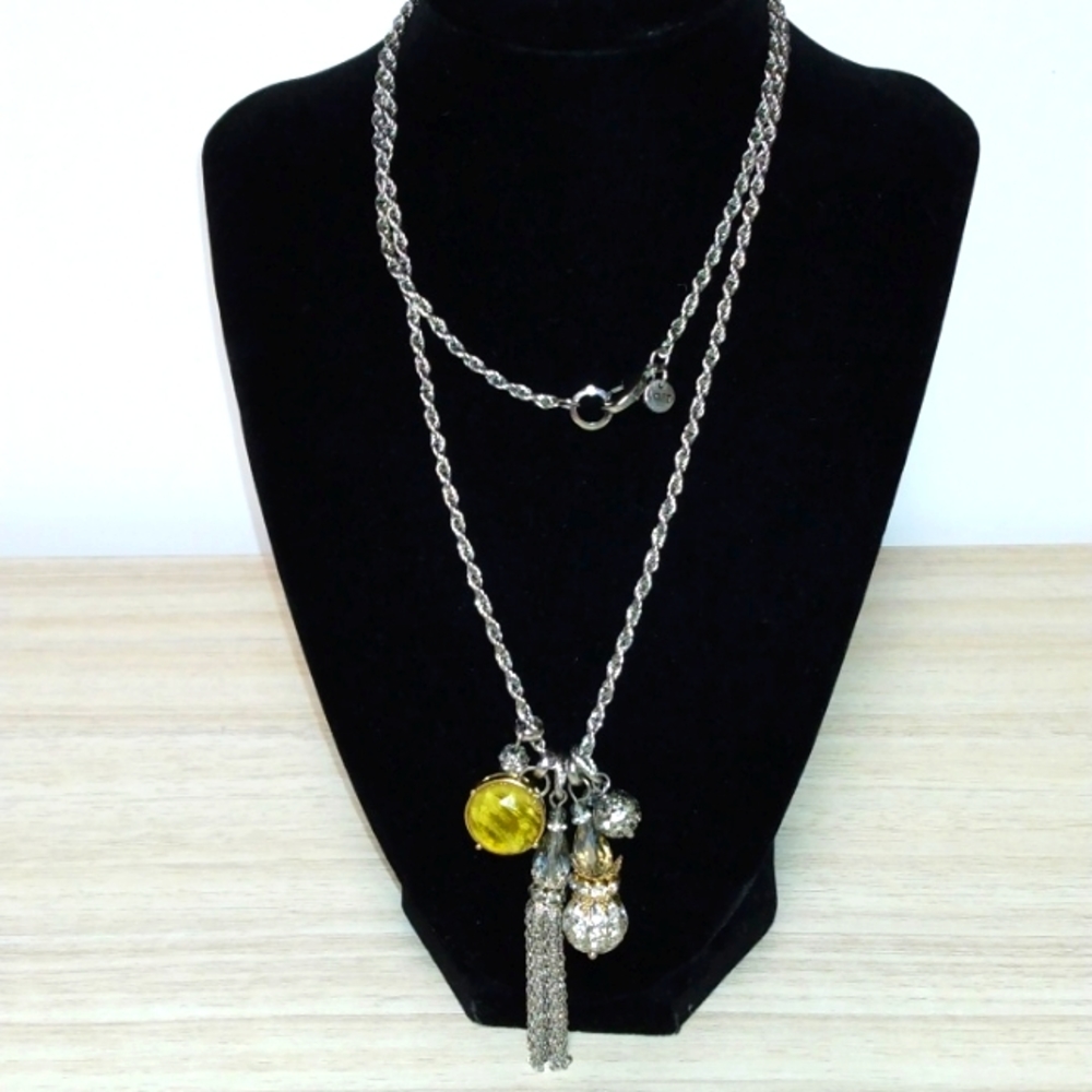 Loft silvertone excellent condition 5 charms all beautiful and one a tassel